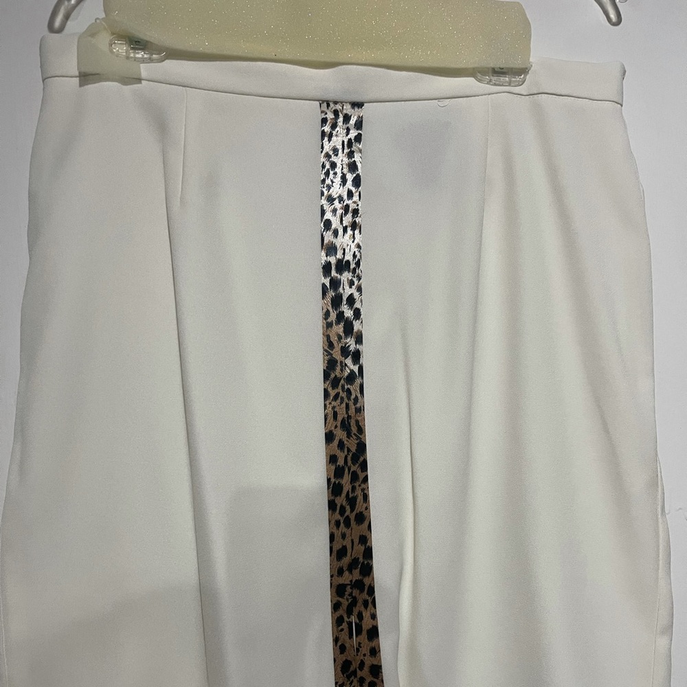 Very nice suit. The skirt is knee length.